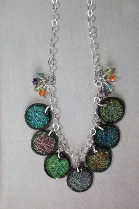 Rainbow Necklace / reversible by Catherine DeYoung | Vitreous enamel on hammered copper with sterling silver findings.
Gemstone drops are amethyst, apa Rainbow Necklace / reversible